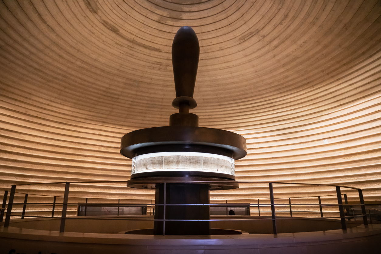 Jerusalem, Israel - April 25, 2019: Dead Sea Scrolls inside the Shrine of the Book, Museum of Israel, Jerusalem. The Dead Sea Scrolls and Isaiah scroll are from the second century BCE, the most intact of the Dead Sea Scrolls, and the Aleppo Codex, dating from the 10th century CE, the oldest existing Hebrew Bible. They were discovered between 1947-1956 in eleven caves in and around the Wadi Qumran. Givat Ram, Jerusalem, Israel, Middle East